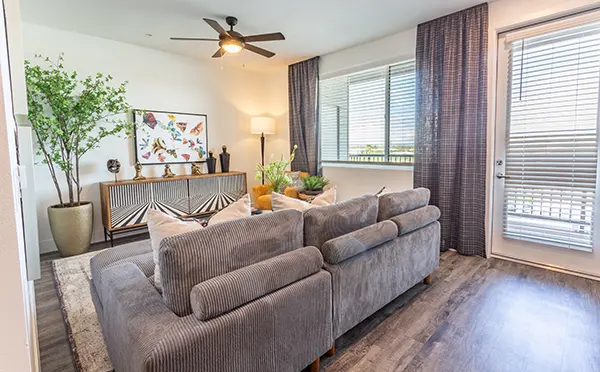 Furnished apartment living area shown at The Governor.